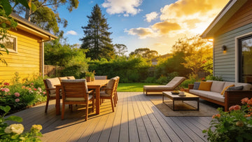 Composite decking in a beautiful outdoor setting with greenery, highlighting durability and aesthetic appeal.